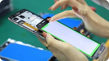 Supplier Quality Control Inspection A quality control expert inspecting a mobile phone screen