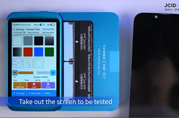 A technician looking at an iPhone logic board under a microscope