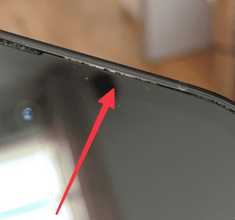 A close-up of a phone screen with a detached frame.