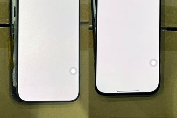 Repair shop owner inspecting iPhone screen